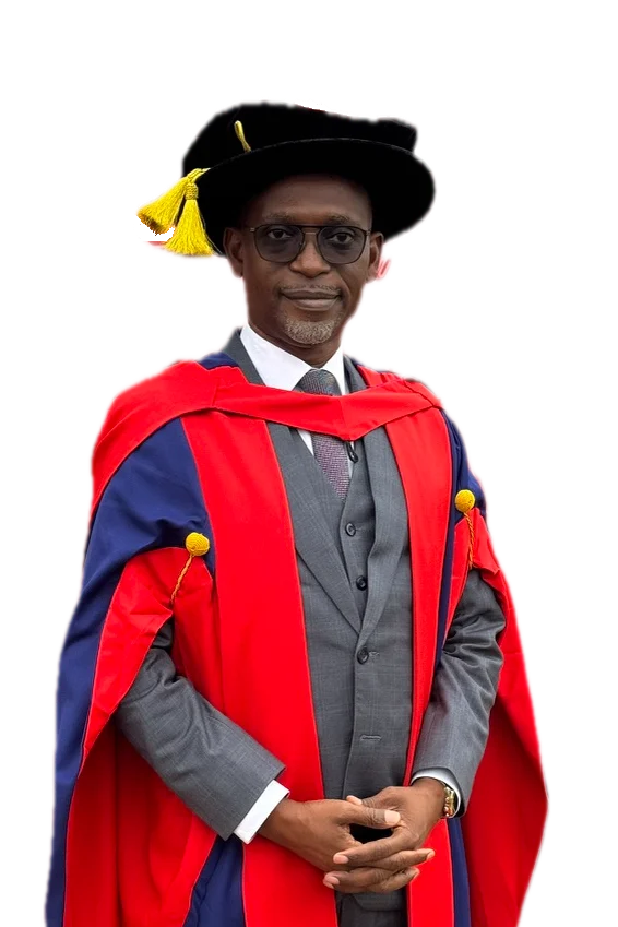 Dr Michaels Aibangbee smiling in Western Sydney University doctoral robes and bonnet, hands clasped